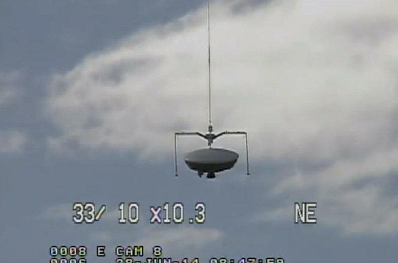 This image taken from video provided by NASA shows the launch of the high-altitude balloon carrying this saucer-shaped vehicle for NASA, Saturday June 28, 2014 in Kauai, Hawaii. Saturday's experimental flight high in Earth's atmosphere is testing technology that could be used to land on Mars.  (AP Photo/NASA)