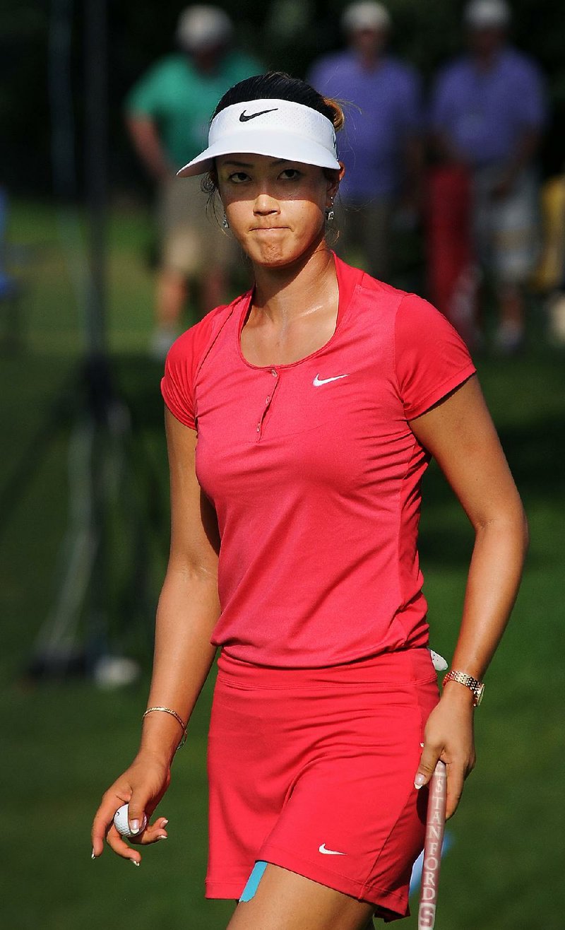 STAFF PHOTO BEN GOFF  @NWABenGoff -- 06/29/14  Michelle Wie walks off of the 18th green after completing her put during the final round of the Walmart NW Arkansas Championship presented by P&G at Pinnacle Country Club in Rogers on Sunday June 29, 2014. 