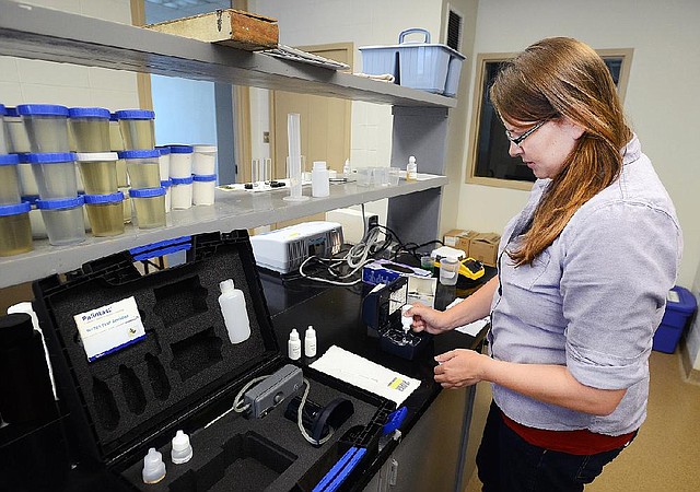 STAFF PHOTO SAMANTHA BAKER • @NWASAMANTHA

Jenny Doyle, engineering intern, demonstrates how to test a water sample in Palintest's ChlordioX Plus Thursday, June 26, 2014, at Beaver Water District in Lowell. The device tests for chlorine dioxide, chlorine and chlorites, and is portable.