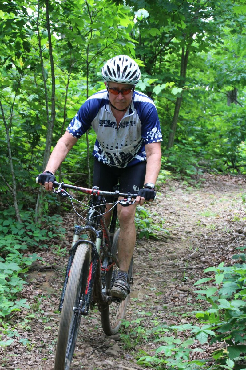 Special to the Democrat-Gazette/BOB ROBINSON
Randy Jackson of Fort Smith checks out Fire Tower Trail during the grand opening June 16 of the new Upper Buffalo Mountain Bike Trail in Newton County.