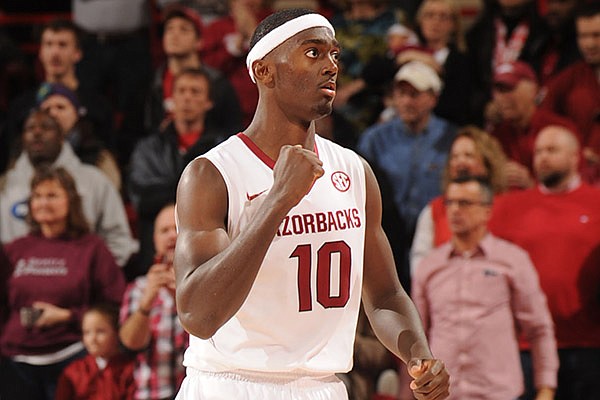 Arkansas freshman Bobby Portis celebrates during the closing moments of the second half of play against Alabama Wednesday, Feb. 5, 2014, in Bud Walton Arena in Fayetteville.