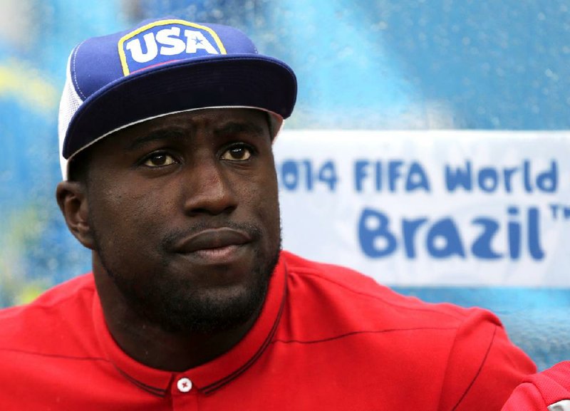 United States' Jozy Altidore watches from the team bench during the group G World Cup soccer match between the United States and Germany at the Arena Pernambuco in Recife, Brazil, Thursday, June 26, 2014. (AP Photo/Julio Cortez)