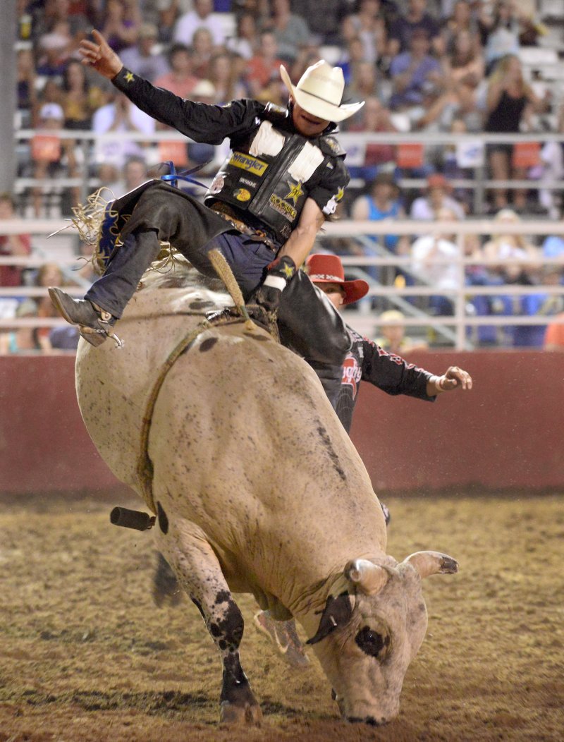FILE PHOTO JASON IVESTER Chase Ethan Outlaw of Tilly competes in the bull riding event July 5, 2013, during the Rodeo of the Ozarks at Parsons Stadium in Springdale.