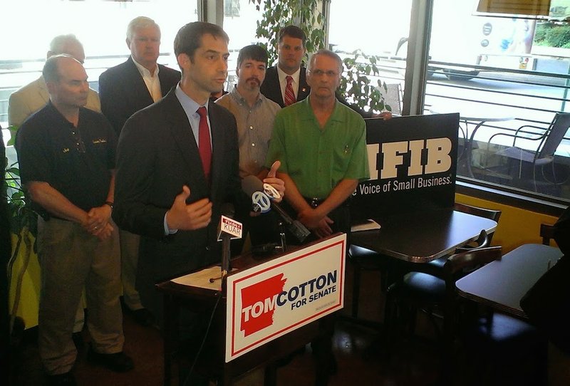 U.S. Rep. Tom Cotton accepts a National Federation of Independent Business endorsement Tuesday, July 1, 2014, at Sufficient Grounds Cafe in downtown Little Rock.