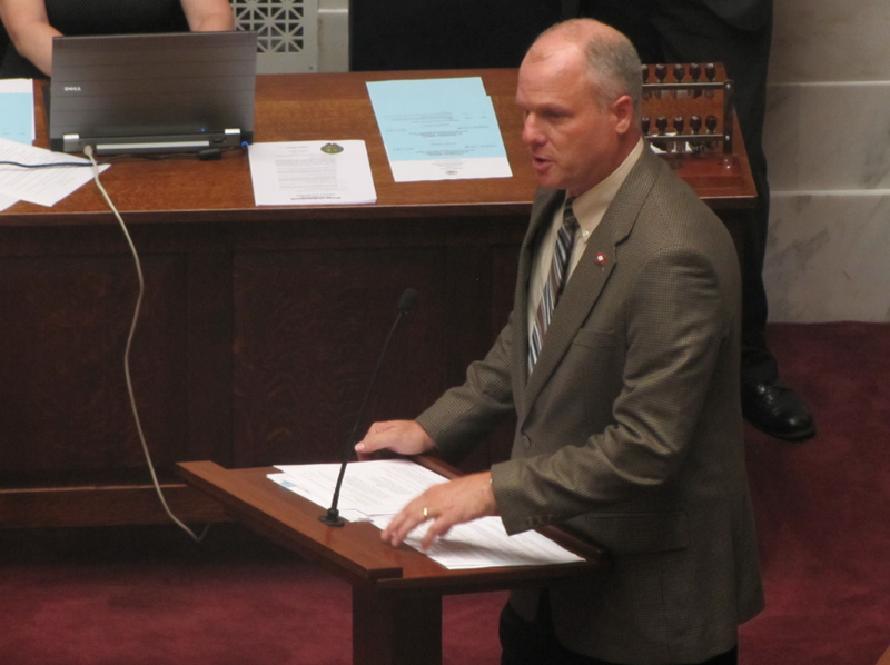 Sen. Jim Hendren, R-Gravette, speaks on the Senate floor Tuesday before votes on two bills on teacher health insurance.