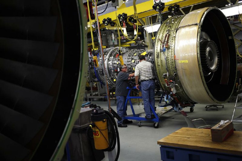 Workers assemble a General Electric Co. jet engine at the GE Aviation factory in Cincinnati last week. The Institute for Supply Management said Tuesday that manufacturing grew in June for the 13th straight month.