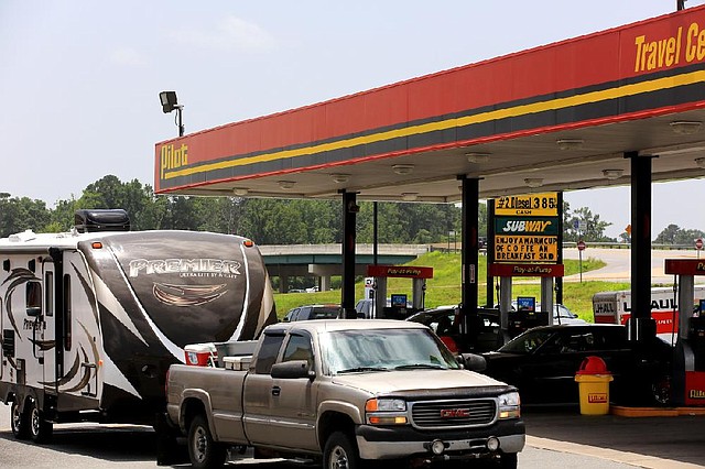 Motorists stop Tuesday at a Pilot Travel Center off Interstate 30 in Bryant. People traveling on the long Fourth of July weekend will see some of the highest gasoline prices since 2008.
