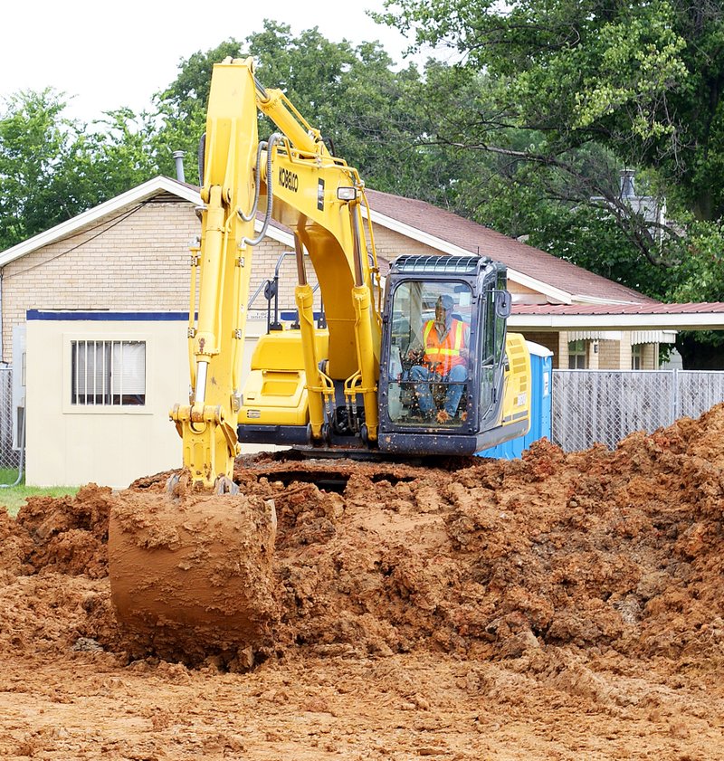 Photo by Randy Moll Though the rain has slowed things down, dirt work is under way at the Gentry branch of the Arvest Bank. Plans are to have a new building in place for the bank branch by the end of the year. Construction is being carried out by Oakridge Builders.