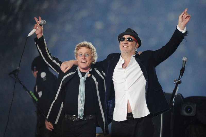 In this Feb. 7, 2010 file photo,Roger Daltrey, left, and Pete Townshend acknowledge the crowd after performing during the second half of the NFL Super Bowl XLIV football game in Miami. Townshend and Daltrey are taking the band on the road for a series of shows in the U.K. celebrating its 50th anniversary. Daltrey suggested it would be their last major tour, referring it to the start of their "long goodbye" during a news conference Monday, June 30, 2014, at Ronnie Scott's jazz bar in London. 