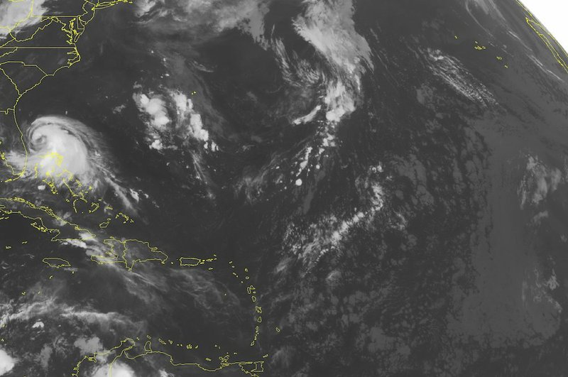 This NOAA satellite image taken Wednesday, July 2, 2014, at 12:45 a.m. Central shows Tropical Storm Arthur over the Northern Bahamas bringing showers and thunderstorms to the Bahamas and southern Florida.