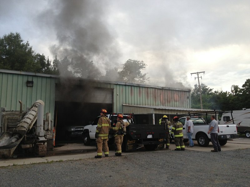 Firefighters work a blaze at Tankersley Company Inc. at 4501 Crystal Hill Road in North Little Rock on July 2, 2014.

