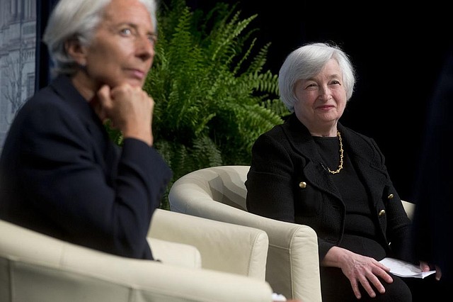Christine Lagarde (left), managing director of the International Monetary Fund and Janet Yellen, chairman of the U.S. Federal Reserve, listen Wednesday as Michel Camdessus, former managing director of the IMF, speaks during an event at the IMF in Washington, D.C.