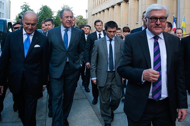 Foreign Ministers (from left) Laurent Fabius of France, Sergey Lavrov of Russia, Pavlo Klimkin of Ukraine and Frank-Walter Steinmeier of Germany leave the German Foreign Ministry for dinner Wednesday in Berlin.