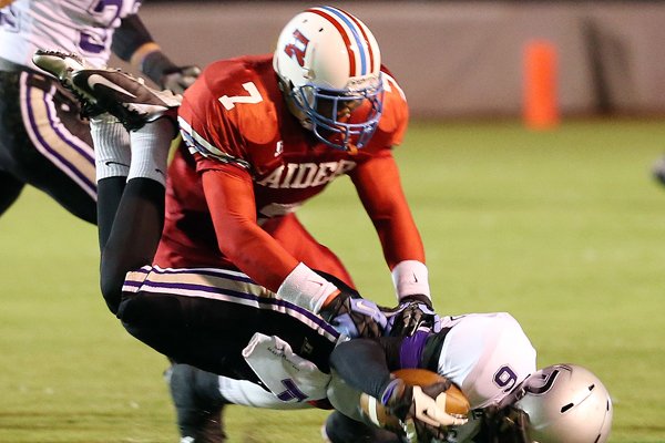 On 4th down and two in the second quarter, Rummel cornerback Dwayne Eugene (7) drops Dutchtown wide receiver Corey McBride (6)short of the first down during the playoff game between Dutchtown and Archbishop Rummel at Joe Yenni Stadium on Friday, November 16, 2012. (Photo by Michael DeMocker, NOLA.com | The Times-Picayune)