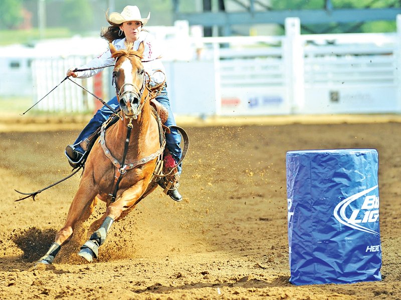 STAFF PHOTO Andy Shupe Andrea Haden celebrated her birthday Tuesday by competing in barrel racing at the Rodeo of the Ozarks in Springdale. She posted a time of 17.88 on her horse, Superman.