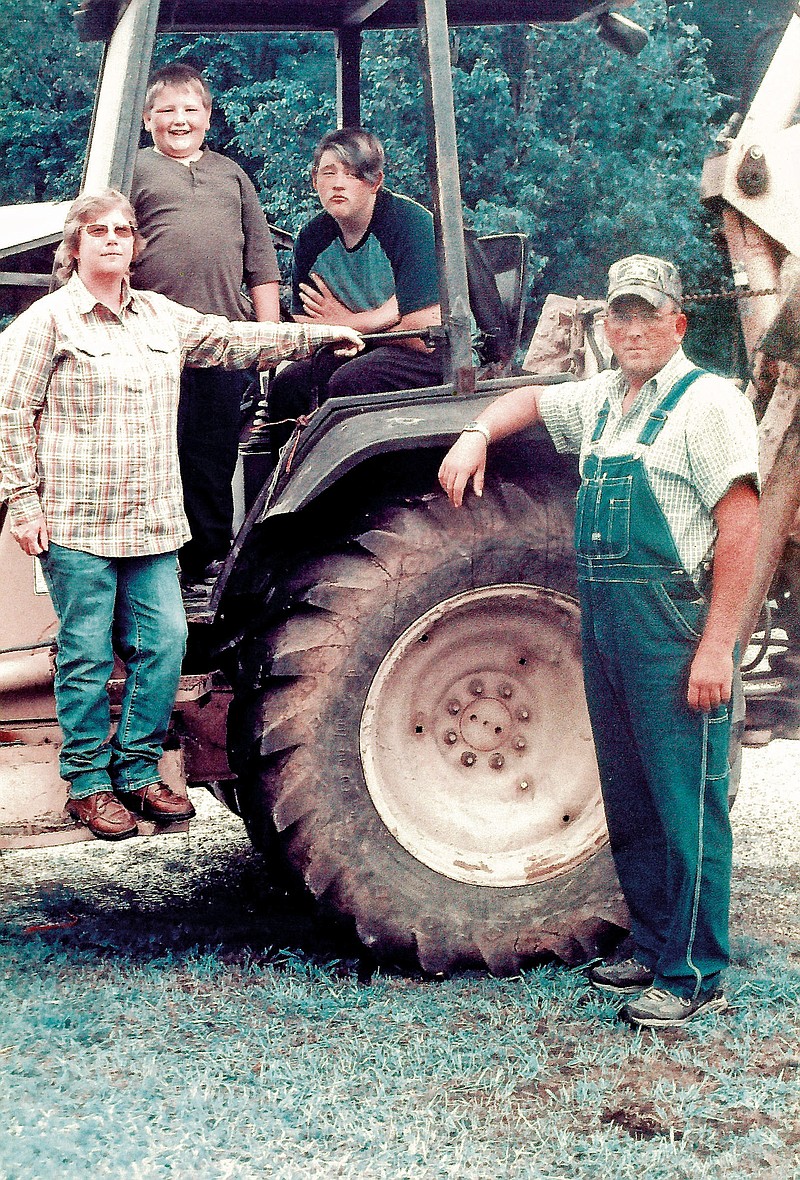 The Scott Wells family of the Corinth community has been named the 2014 Grant County Farm Family of the Year. Family members include, front, from left, Sharron and Scott Wells and their sons, Jesse, 8, and Dusty, 15. The family farms 93 acres. 