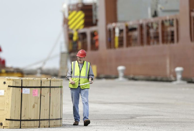 A dockworker inspects a crate to be loaded on the Amsterdambound Fortunagracht at the Port of Cleveland earlier this year. The Commerce Department announced Thursday that exports hit an all-time high in May.