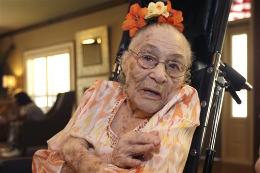 In this Thursday, July 3, 2014 photo, Gertrude Weaver poses at Silver Oaks Health and Rehabilitation Center in Camden, Ark., a day before her 116th birthday. The Gerontology Research Group says Weaver is the oldest person in the United States and second-oldest person in the world. 