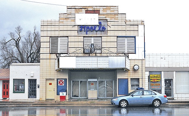 FILE PHOTO SAMANTHA BAKER Rain trickles down on the Apollo Theater in January 2013 at 308 W. Emma Ave. in Springdale. A pair of Springdale businessmen have purchased the building that was scheduled to be razed. The two haven&#8217;t yet disclosed their plan for the building.