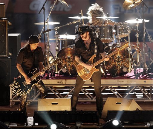In this Saturday, Oct. 7, 2006 file photo, rock band Motorhead performs during the show program of the the "TV total Stock Car Crash Challenge 2006" celebrities race at the Veltins-Arena in Gelsenkirchen, western Germany. While its critics often dismiss heavy metal as the music of the devil, it turns out the genre can actually be hazardous to your health. German doctors say they treated a man whose headbanging habit ultimately led to a brain injury, but they say the risk to fans is so small they shouldn’t give up their rhythmic ways. 