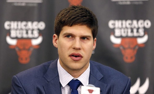 Basketball player Doug McDermott responds to a question as the Chicago Bulls first round NBA draft pick during a news conference Monday, June 30, 2014, in Deerfield, Ill. (AP Photo/Charles Rex Arbogast)