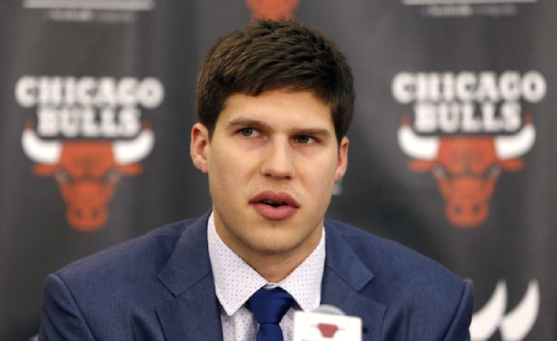 Basketball player Doug McDermott responds to a question as the Chicago Bulls first round NBA draft pick during a news conference Monday, June 30, 2014, in Deerfield, Ill. (AP Photo/Charles Rex Arbogast)