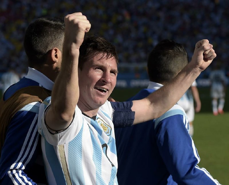 Argentina's Lionel Messi celebrates after Angel di Maria scored his side's only and winning goal in extra time during the World Cup round of 16 soccer match between Argentina and Switzerland at the Itaquerao Stadium in Sao Paulo, Brazil, Tuesday, July 1, 2014. Argentina defeated Switzerland 1-0 to move on to the quarterfinals. (AP Photo/Manu Fernandez)