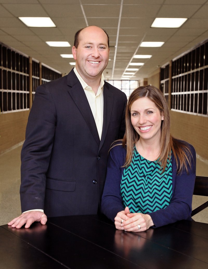 FILE PHOTO BEN GOFF Patrick Woodruff and his wife, Meredith, pose Feb. 19 at Elmwood Middle School in Rogers.