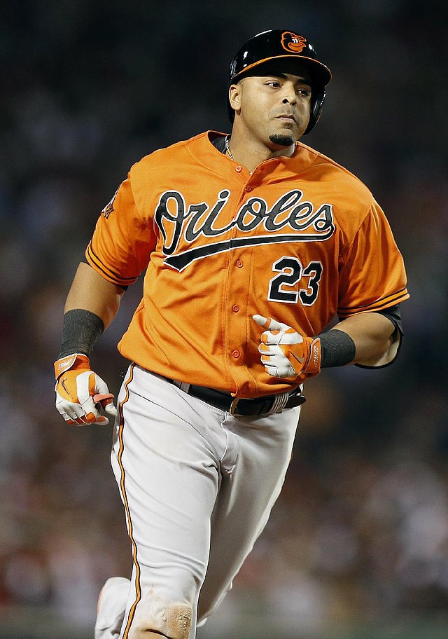 Baltimore Orioles' Nelson Cruz rounds third base on a solo home run in the fifth inning of the second game of a baseball doubleheader against the Boston Red Sox in Boston, Saturday, July 5, 2014. (AP Photo/Michael Dwyer)