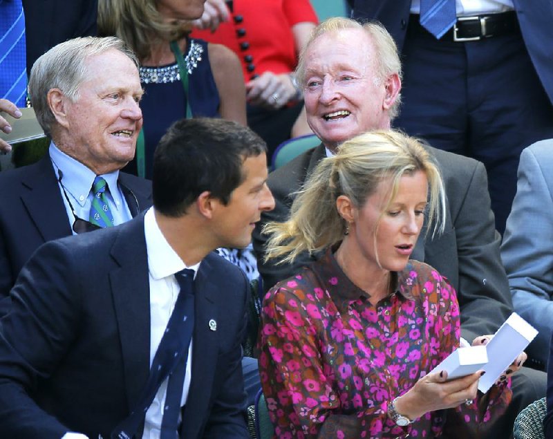 Wimbledon’s men’s semifinals had a major feel to them Friday with Jack Nicklaus (left) and Rod Laver (right) watching from the stands. Nicklaus won 18 majors during his golf career, and Laver won 11 majors during his tennis career.