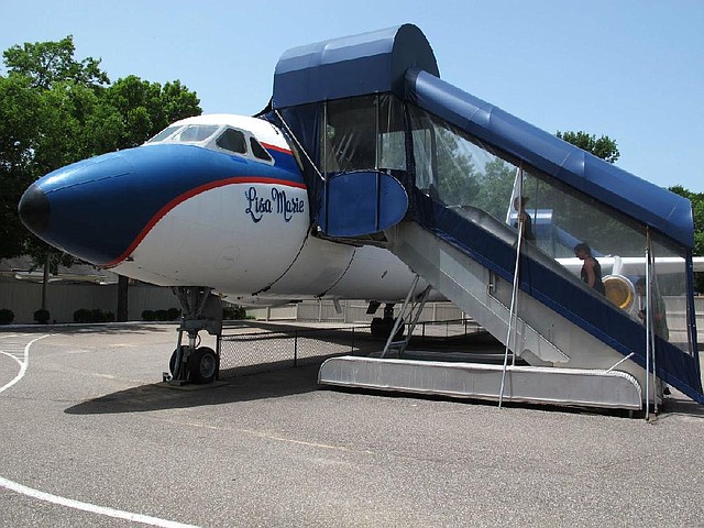 This photo taken on Tuesday, July 1, 2014, shows the Lisa Marie, one of two jets once owned by late singer Elvis Presley, that is used as a tourist exhibit at the Graceland tourist attraction in Memphis, Tenn. The company that operates the Graceland tourist attraction has told the current owners of the Lisa Marie, and another plane called the Hound Dog II, that it wants the planes removed from Graceland by late April 2015, or shortly afterward. (AP Photo/Adrian Sainz)