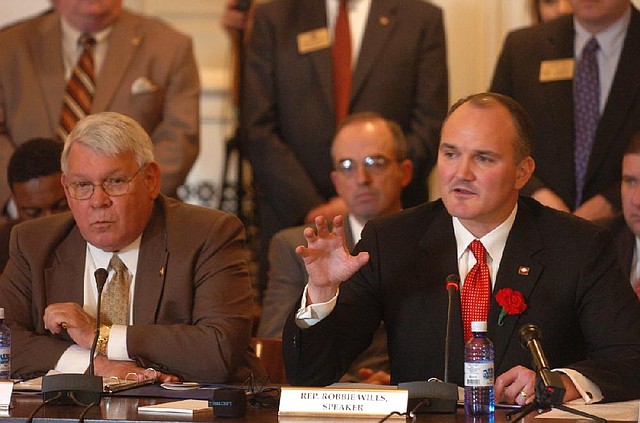 Former state lawmakers Terry Smith (left) and Robbie Wills, shown in 2009, sponsored bills creating the state lottery and a 12-member legislative committee to oversee a lottery commission.