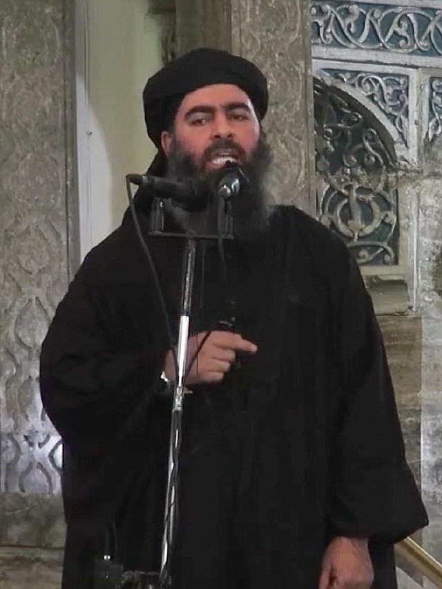 This image taken from the website of an extremist group calling itself the Islamic State purportedly shows the group’s leader, Abu Bakr al-Baghdadi, delivering a sermon Saturday in Iraq.
