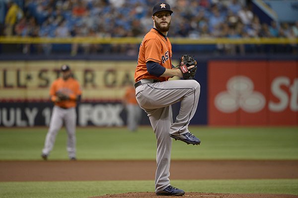 Houston Astros starting pitcher Dallas Keuchel, right, goes through his windup during the first inning of a baseball game against the Tampa Bay Rays in St. Petersburg, Fla., Sunday, June 22, 2014.(AP Photo/Phelan M. Ebenhack)