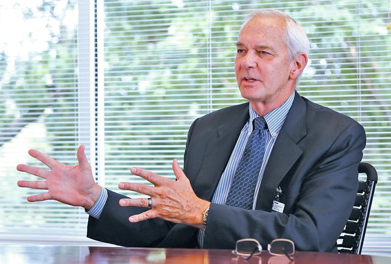 STAFF PHOTO DAVID GOTTSCHALK Paul Hewitt, the new superintendent of Fayetteville Public Schools, speaks Monday inside his office in the Fayetteville Public School Administration Building.