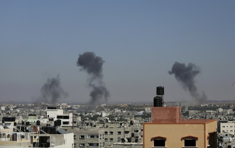 Smoke rises after an Israeli missile strike in Gaza City on Tuesday, July 8, 2014. The Israeli military launched what could be a long-term offensive against the Hamas-ruled Gaza Strip on Tuesday striking nearly 100 sites in Gaza and mobilizing troops for a possible ground invasion aimed at stopping a heavy barrage of rocket attacks against Israel.