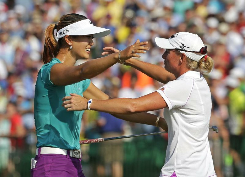 For all of their differences, Michelle Wie (left) and Stacy Lewis have become friends on and off the golf course.They are leading an American revival going into the Women’s British Open at Royal Birkdale.