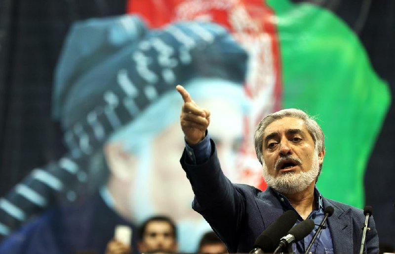 Afghan presidential candidate Abdullah Abdullah speaks during a gathering of his supporters in Kabul on Tuesday.