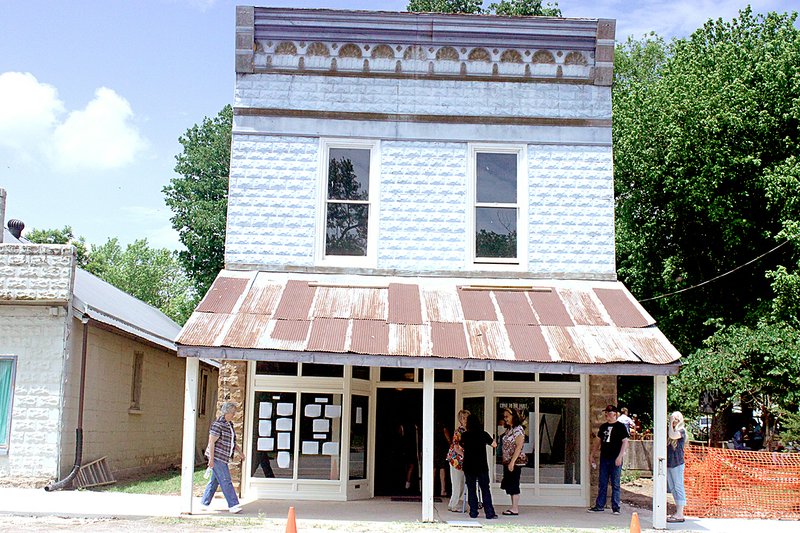 Staff Photo Lynn Kutter Residents of Cane Hill and surrounding towns showed up May 24 to see the A.R. Carroll Drugstore in Cane Hill. The drug store building, which had fallen into disrepair, has been restored to its original look for the community to enjoy and use.