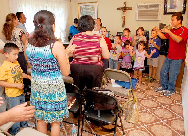 Photo by Janelle Jessen A group of about 30 people met for worship and Bible study in the home of Jesus and Maria Tirado in Decatur last Tuesday. The group has been meeting on Tuesdays for Bible study and on Thursdays to pray the Rosary in various homes in Decatur for the past 15 months.