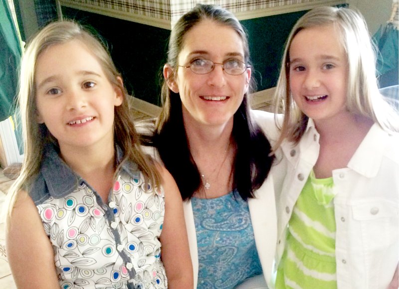 Submitted Photo Blair Savage-Lansden, center, now enjoys time with her 8-year-old twin daughters, Madeline and Delaney.