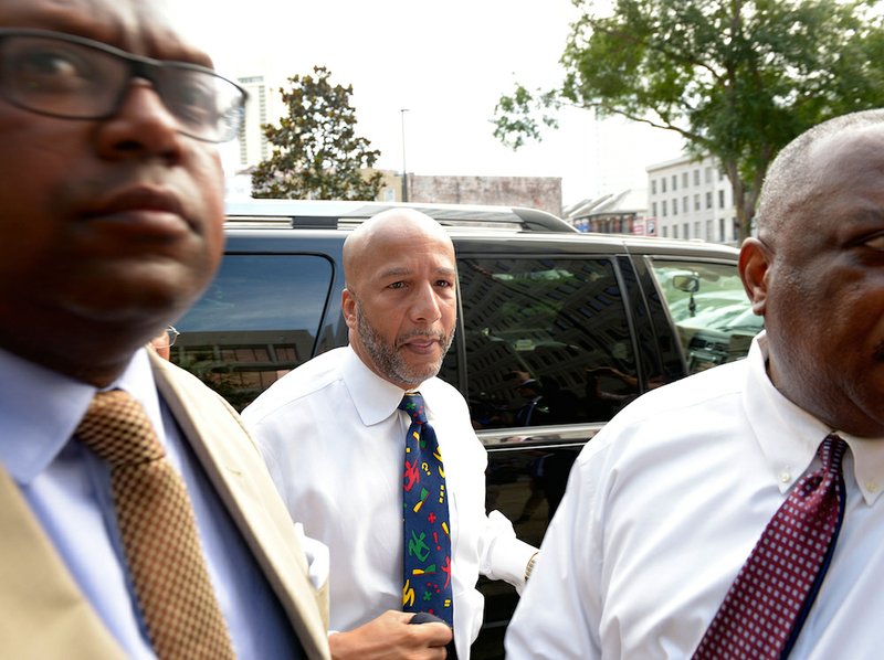 Former New Orleans Mayor Ray Nagin is surrounded by media as he arrives for his sentencing hearing Wednesday, July 9, 2014, in New Orleans. Nagin was sentenced to 10 years in prison on Wednesday for his conviction on bribery, money laundering and other corruption charges.