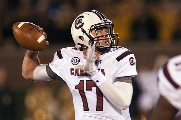 In this Oct. 26, 2013 file photo, South Carolina quarterback Dylan Thompson throws a pass during the first quarter of an NCAA college football game against Missouri, in Columbia, Mo. (AP Photo/L.G. Patterson, File)