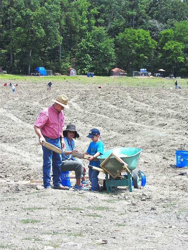 A family digs together in the 37-acre gem field at Crater of Diamonds State Park, two miles southeast of Murfreesboro.