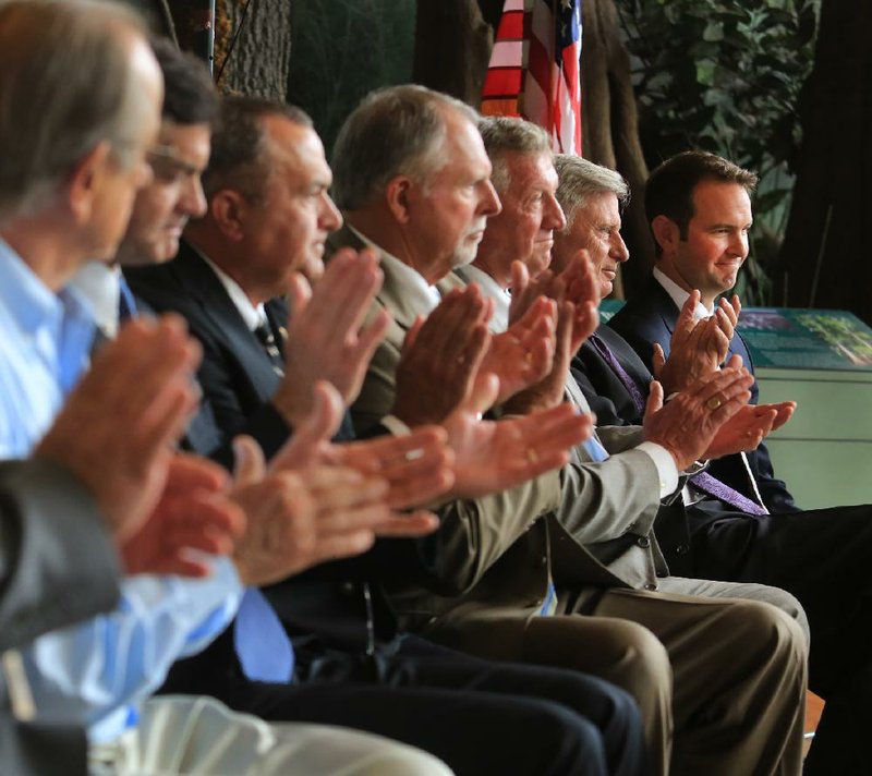 Gov. Mike Beebe (second from right) and commissioners for the Arkansas Game and Fish Commission honor Andrew Parker (far right) of Little Rock as a new commissioner at a ceremony Wednesday at the Witt Stephens Jr. Central Arkansas Nature Center in Little Rock. Parker served as Beebe’s liaison to the commission from 2007-2010.