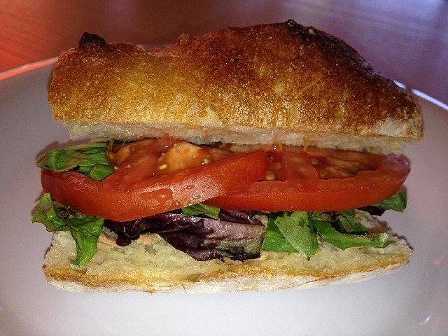 A half serving of a tuna sandwich comes on a richly textured hoagie roll at Cafe Brunelle.