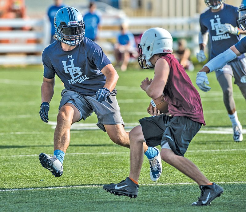 STAFF PHOTO ANTHONY REYES Zach Ownbey of Springdale Har-Ber closes in on a Huntsville receiver Monday in 7-on-7 action at Har-Ber. Ownbey is a projected starter at outsider linebacker for the Wildcats.