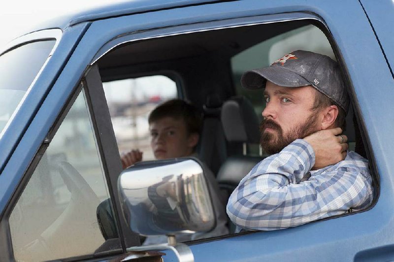 Fourteen-year-old Jacob Wilson (Josh Wiggins) and his father, Hollis (Aaron Paul), have some growing up to do in Kat Candler’s Hellion, a naturalistic portrait of a wounded family.