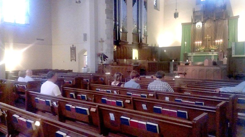 People wait on Sunday, July 6, 2014, for Christ Church Little Rock's Compline Service to begin. 