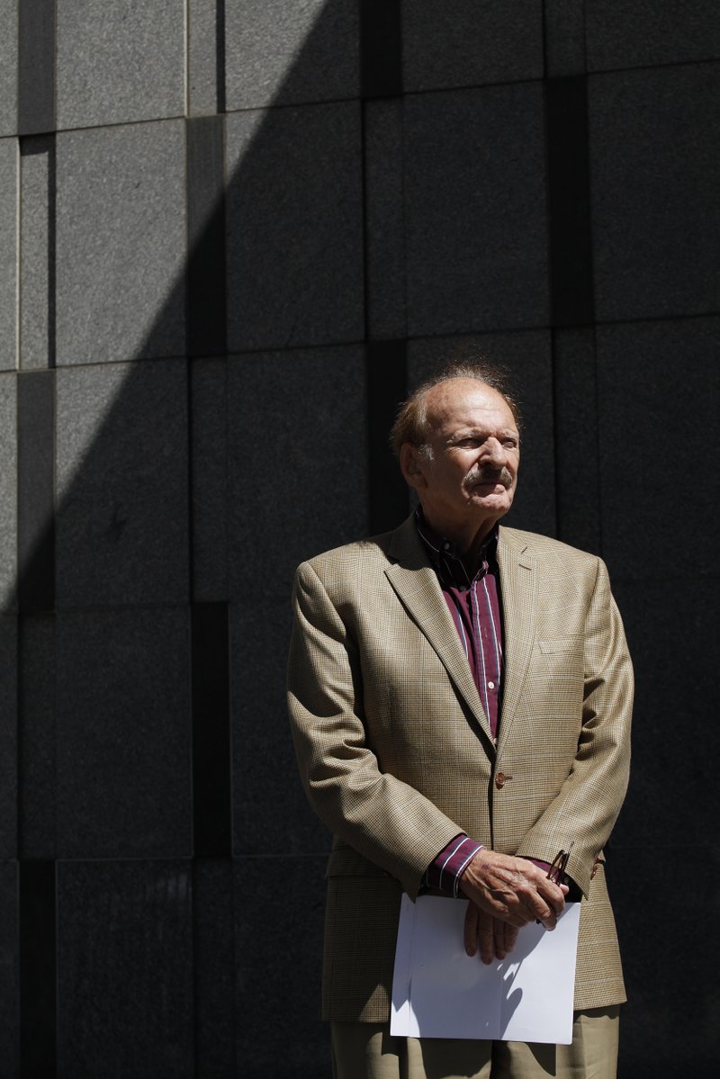 James Prigoff stands in front of the San Francisco Federal Building waiting for a news conference to begin on Thursday, July 10, 2014. Prigoff is one of several California men suing the Department of Justice over an information-sharing program designed to help flag potential terrorism activity. Prigoff said he was visited at his California home by a member of a joint-terrorism task force months after trying to photograph a piece of public art in Boston on a natural gas storage tank.